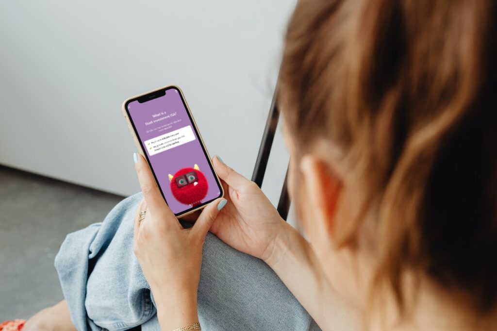 Woman using the AJ Bell Dodl app