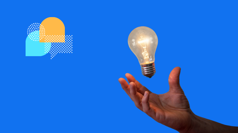 Hand reaching for a lightbulb to represent insight