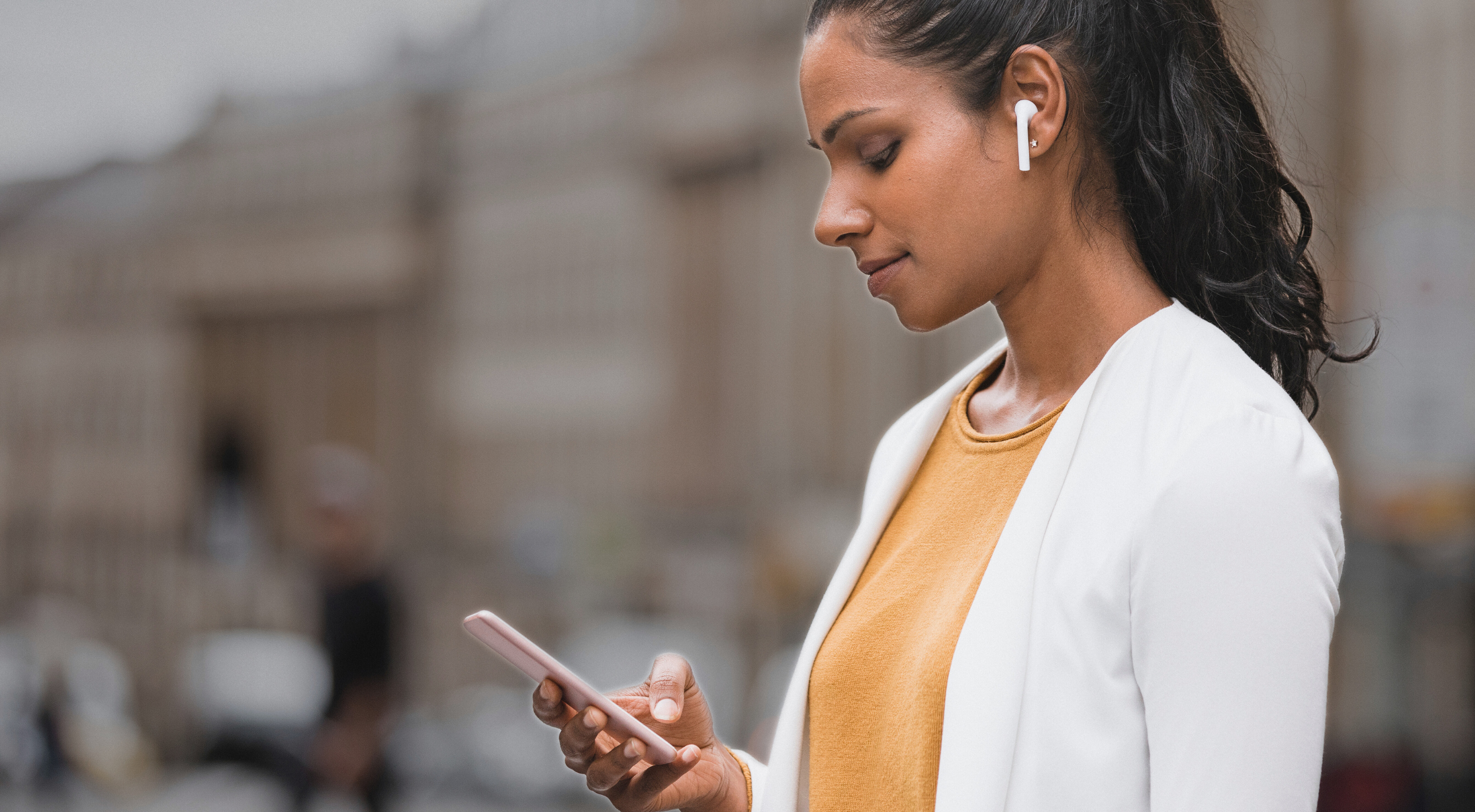 Woman using her phone in Newcastle City Centre